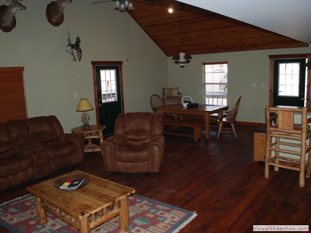 Great room view of kitchen, dining nook, and living room seating.<br/>