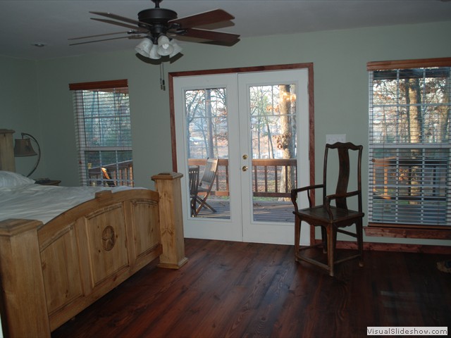 Master bedroom, bath, and king bed with a view of Lake Bob Sandlin and a private wrap around porch.<br/>